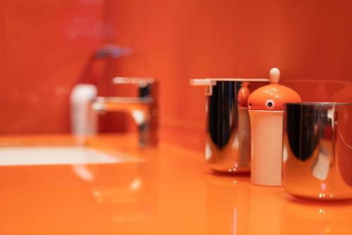 a counter top with two coffee pots on it at Suite Vali in Nafpaktos