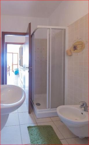 a bathroom with a shower and a sink at La Loggia di Vanda - Goelba in Rio nellʼElba