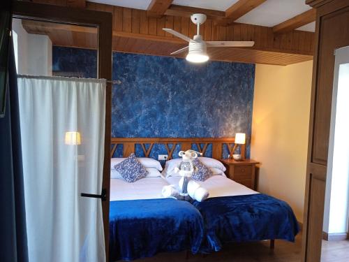 A bed or beds in a room at Apartaments Arenys De Boi