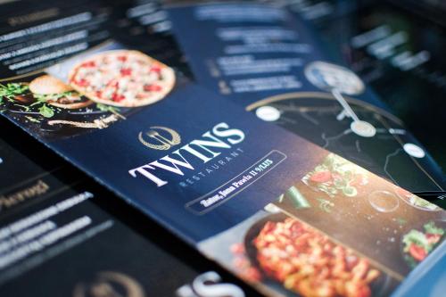 a menu for a restaurant with two pizzas on it at Just 5 by Housine in Zator