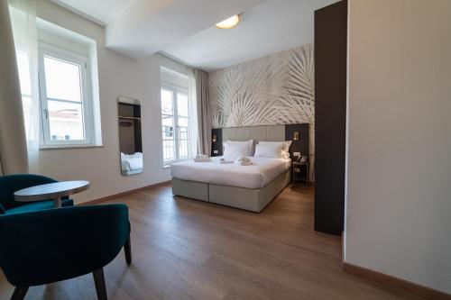 Postel nebo postele na pokoji v ubytování Hotel Arilica