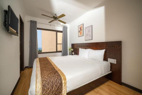 Postel nebo postele na pokoji v ubytování Zenta Beach View Hotel