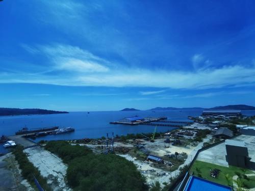 a view of a body of water with a harbor at Kota Kinabalu Jesselton Quay Sea View with washing machine in Kota Kinabalu