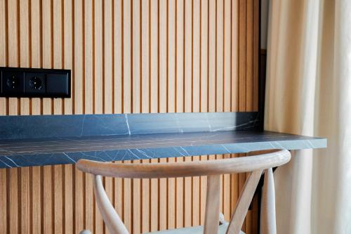 a counter in a room with a wooden wall at Hotel Acta Madfor in Madrid
