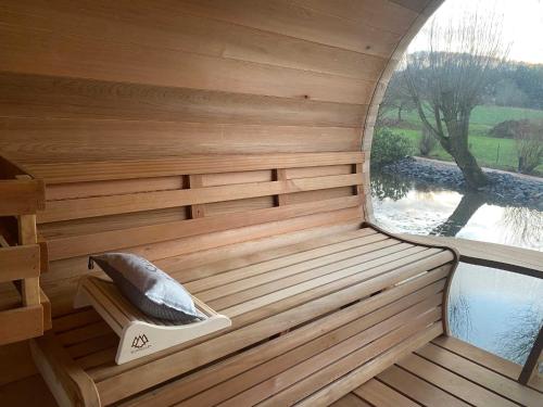 a sauna with a large window and a tub at DRIEHOF LifeStyle Comfort Apt 4 in Tecklenburg