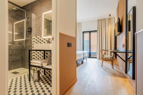 a bathroom with a shower and a sink at Hotel Acta Madfor in Madrid