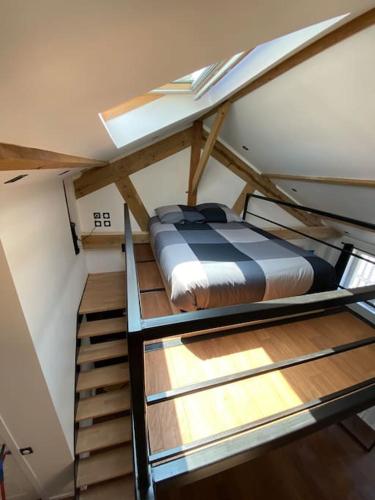 a bedroom with two bunk beds in a room at Loft: Le New-York in Rouen