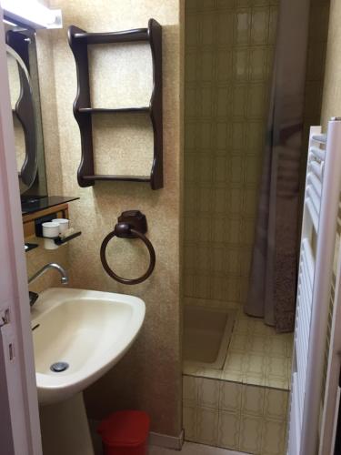 a bathroom with a sink and a shower and a tub at Studio Le Fontagnel in Molines-en-Queyras