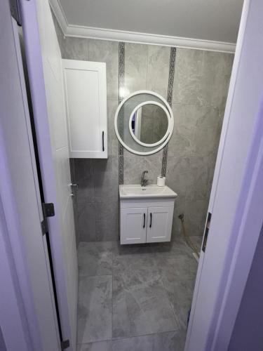 a bathroom with a sink and a mirror at ŞEN BUTİK OTEL ve BUNGALOV in Uzungol