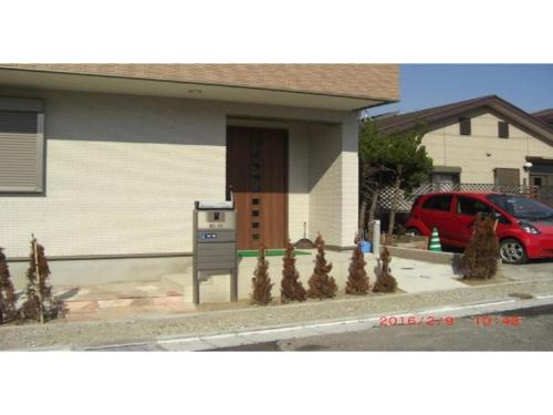 a house with a parking meter in front of it at 2-10-15 Imagawa - Apartment / Vacation STAY 7905 in Tokyo