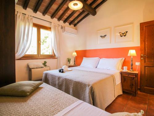 Katil atau katil-katil dalam bilik di Agriturismo Boschi di Montecalvi