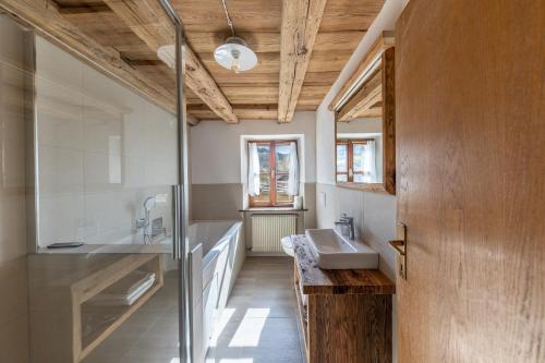 a bathroom with a sink and a mirror at Malgorerhof Mathilde in San Genesio Atesino