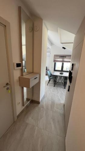an empty room with a kitchen and a dining room at Vito in Gradac