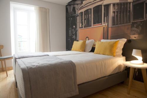 Ένα ή περισσότερα κρεβάτια σε δωμάτιο στο Páteo Saudade Lofts
