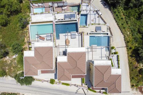 an aerial view of a house with a pool at Studio Thetis in Meganisi