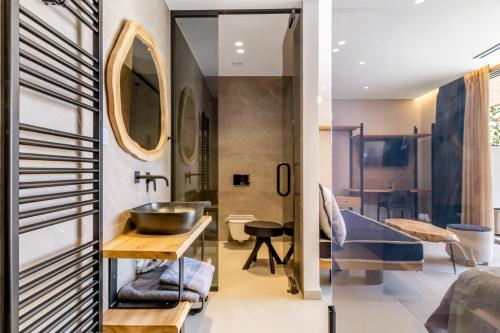 a bathroom with a sink and a mirror at Studio Thetis in Meganisi