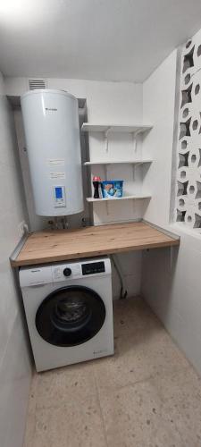 a laundry room with a washing machine and a dryer at Casa adosada Gran Avenida con billar in Benicàssim