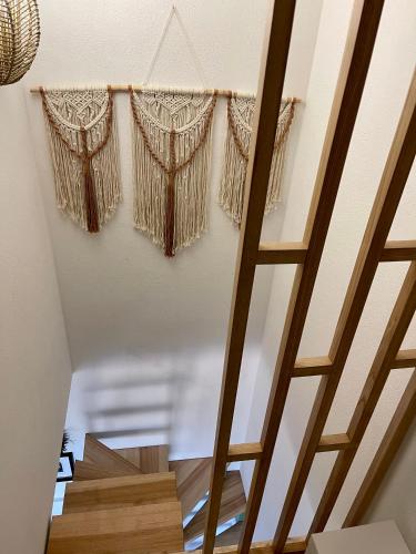 a staircase with curtains hanging from a ceiling at Villa Patty in Marzamemi