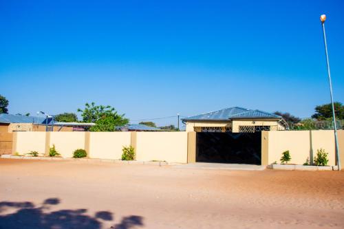 a building with a gate and a fence at Home@Amalia’s in Rundu