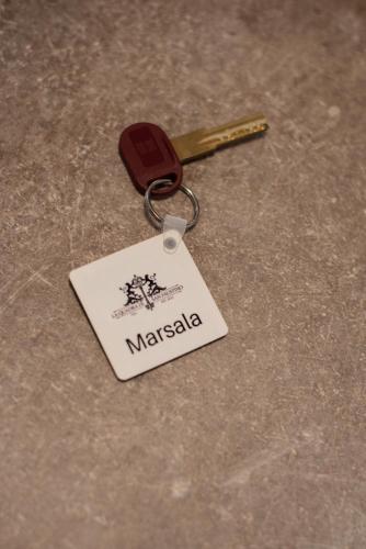 a key chain with a tag that says macaza at Palazzetto La Quadra di San Faustino - F&L Apartment in Brescia