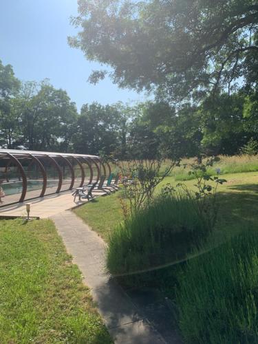 a row of park benches in a park at La ferme d'aristide in Saillenard