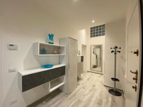 a bathroom with a walk in shower and a toilet at Villa Rosy in San Vincenzo