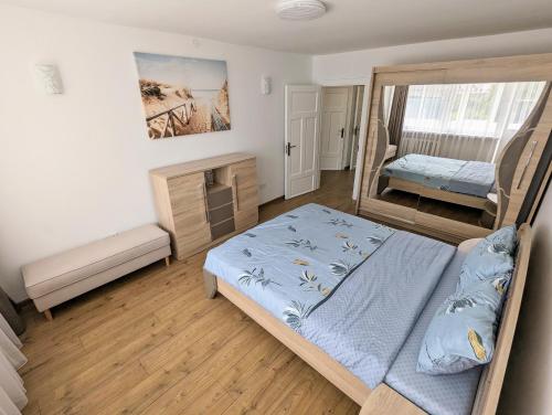 מיטה או מיטות בחדר ב-Lovely 2-bedroom flat in the heart of Druskininkai