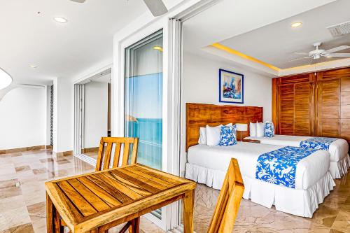 Ένα ή περισσότερα κρεβάτια σε δωμάτιο στο Blue Horizon 903 at Residences