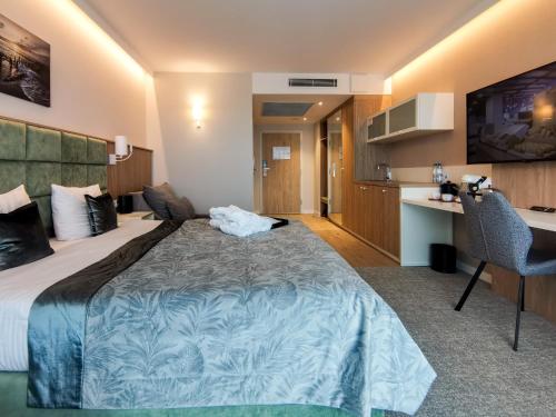 Säng eller sängar i ett rum på Bel Mare Prestige by Four Seasons