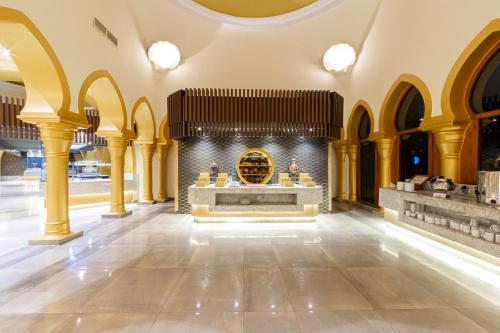 a large lobby with a fireplace and an organ at The Grand Resort in Hurghada