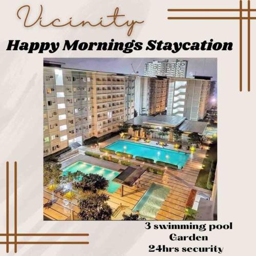 a picture of a swimming pool in a city at Happy Mornings Staycation at Trees Residences QC in Manila