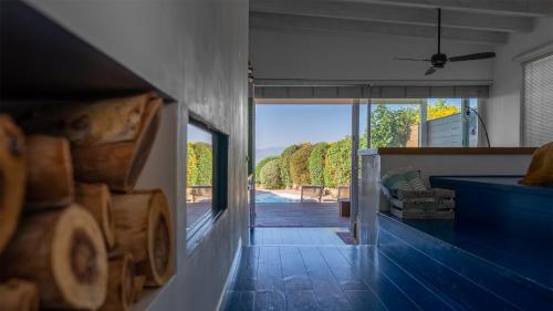 a hallway of a house with a view of a porch at Adika in Ma'ale Gamla