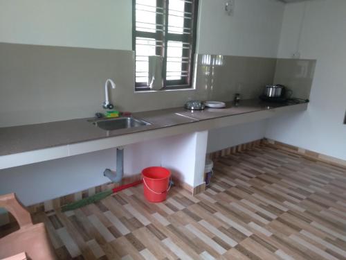 Η κουζίνα ή μικρή κουζίνα στο Homely Homestay