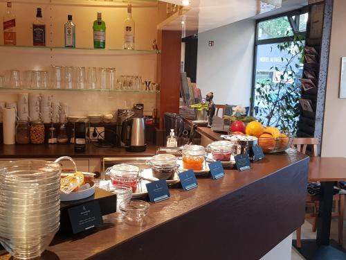 a counter with a bunch of food on it at Hotel Altm&uuml;nchen by Blattl in Munich
