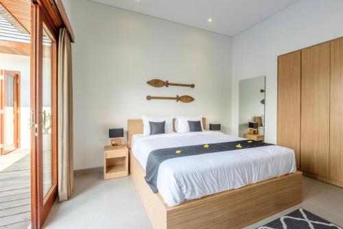 A bed or beds in a room at Villa Dedara