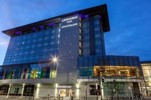 a building with a sign on the side of it at Leonardo Hotel Aberdeen in Aberdeen
