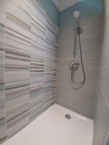 a shower with a glass door in a bathroom at Rêve de Loire chambres d'hôtes au calme au pied des châteaux de la Loire in Onzain