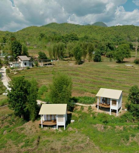 an aerial view of two houses in a field at Monko Villa in Pai
