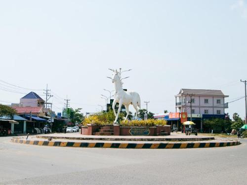 a statue of a horse standing on top of a street at Kep Villa Hill Guest House 1 in Kep