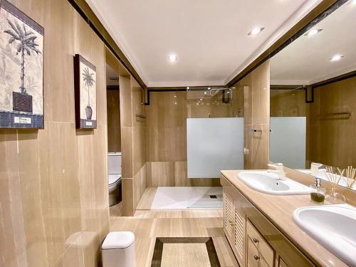 a bathroom with a sink and a toilet at SUPERIOR 3 bedroom MARBELLA center close to beach in Marbella