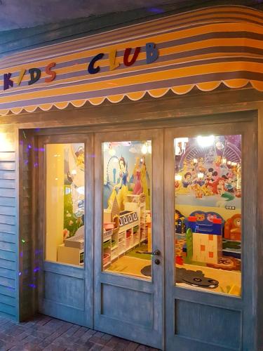 a store front with glass doors and a sign on it at Luxury Dreamland Oasis Apartments in Chakvi