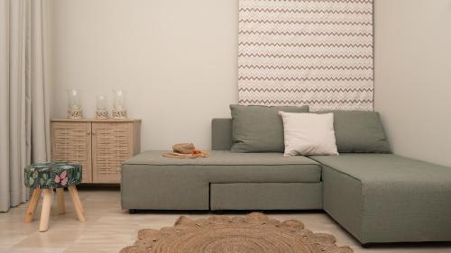 a living room with a couch and a table at Beach House Lefkes in Plános