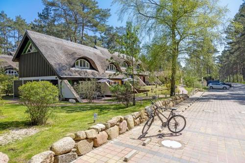 a bike parked in front of a house at Ferienhaus Wolters in Ostseebad Karlshagen