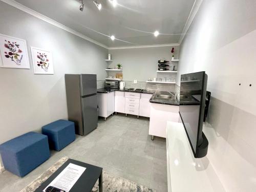 Kuchyň nebo kuchyňský kout v ubytování Reros Apartments in Mankweng