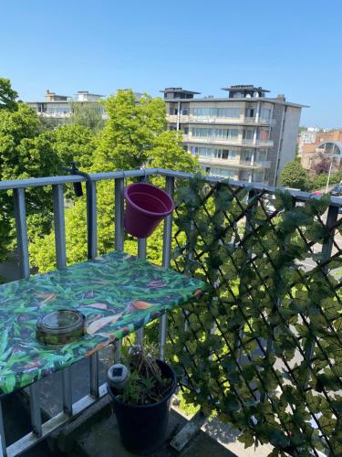 a balcony with a table and a fence at Studio Brussels Expo in Brussels