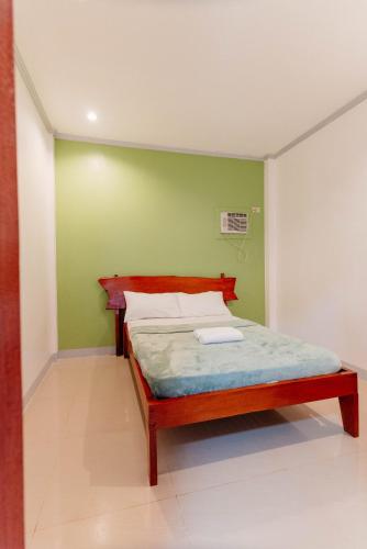 Postel nebo postele na pokoji v ubytování Kawayan Hostel