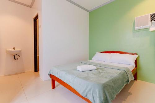 Postel nebo postele na pokoji v ubytování Kawayan Hostel