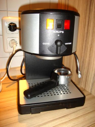 a coffee maker sitting on top of a table at Strandläufer Zempin in Zempin