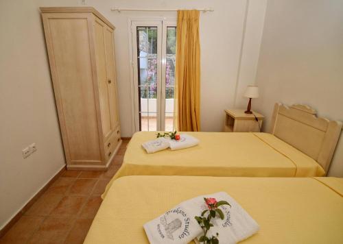 Ένα ή περισσότερα κρεβάτια σε δωμάτιο στο Timessa Mezonette - Agios Kirikos