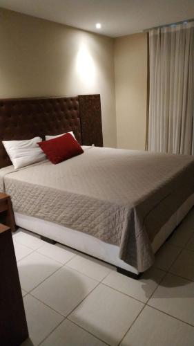 Ένα ή περισσότερα κρεβάτια σε δωμάτιο στο Hotel Village Toritama